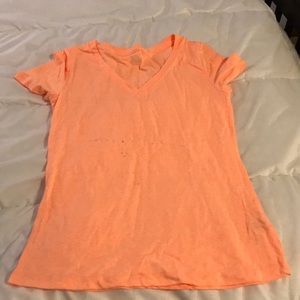 Bright orange T-shirt.
